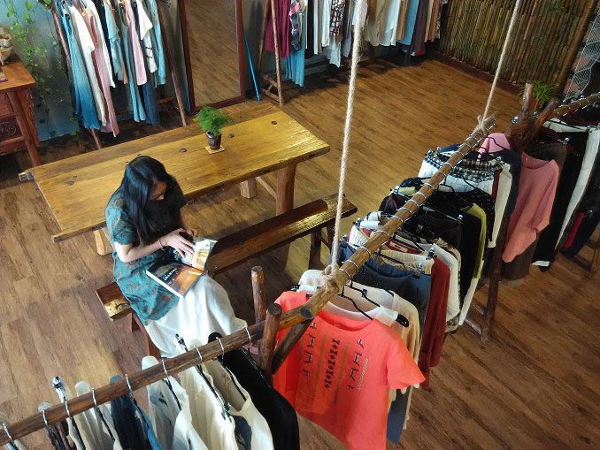 Artisan working with linen fabric in natural light